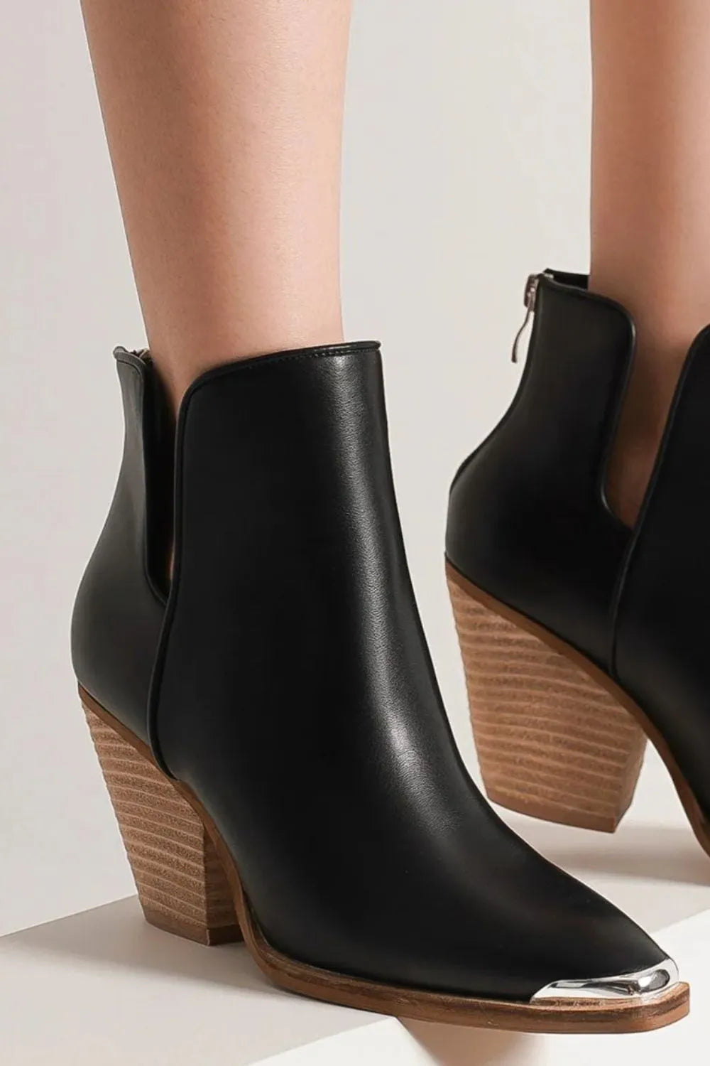 Trendsi Beast Fashion pointed metal-tip toe block heel ankle boots with sleek design and ankle height silhouette.