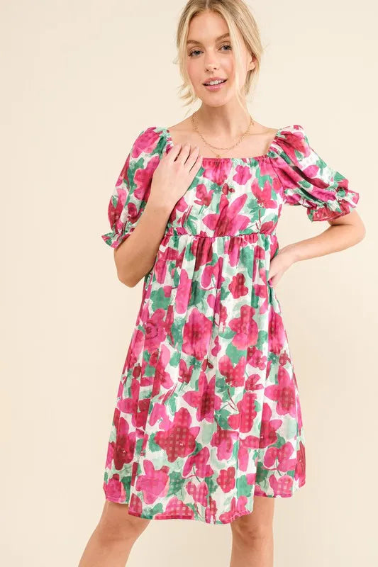 Smocked floral ruffle mini dress with short sleeves from Trendsi, featuring a feminine, lightweight design with a fitted waist and ruffled hem.