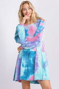 Plus size Umgee tie-dye babydoll dress with round neck, long sleeves, and tiered skirt, featuring vibrant colors and comfortable fit.