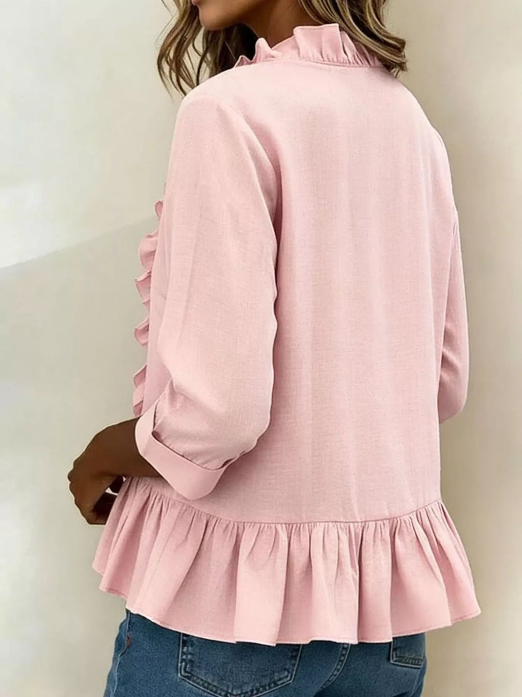 Plus size ruffled v-neck long sleeve blouse by Trendsi, featuring a full size, feminine ruffle details and comfortable fit.