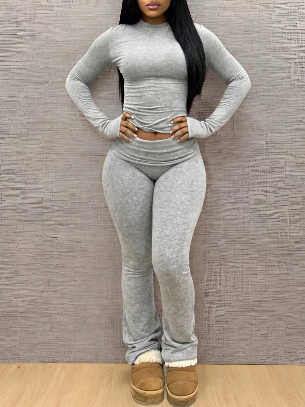 Slim-fit long sleeve crop top and matching leggings lounge set by Trendsi, shown in black with comfortable, stretchy fabric.