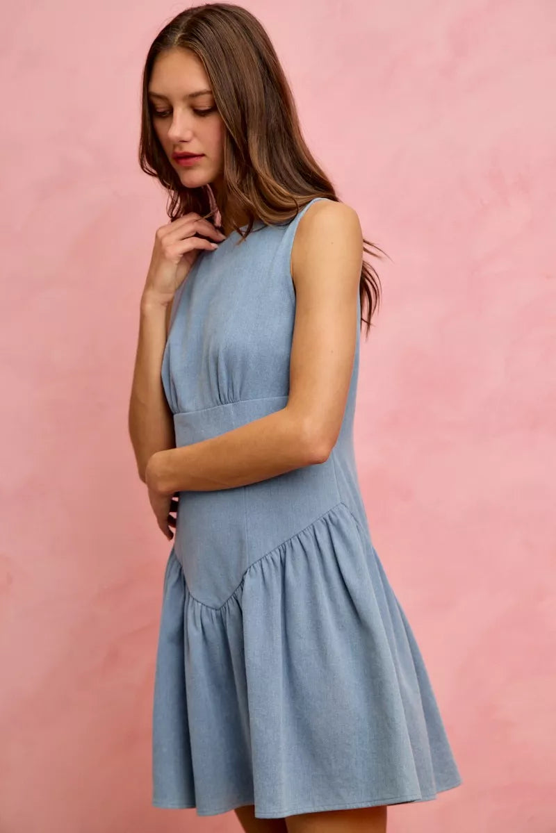 Sleeveless denim mini dress with fit and flare style by Trendsi, featuring a classic denim fabric and a flattering silhouette.