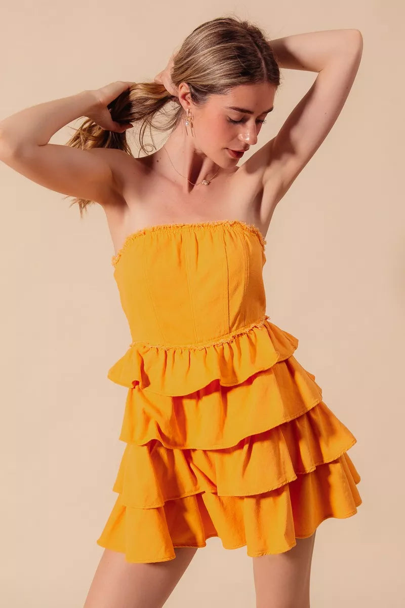 Trendsi SO ME strapless ruffle layered game day cheer up dress displayed on a hanger with a white background.