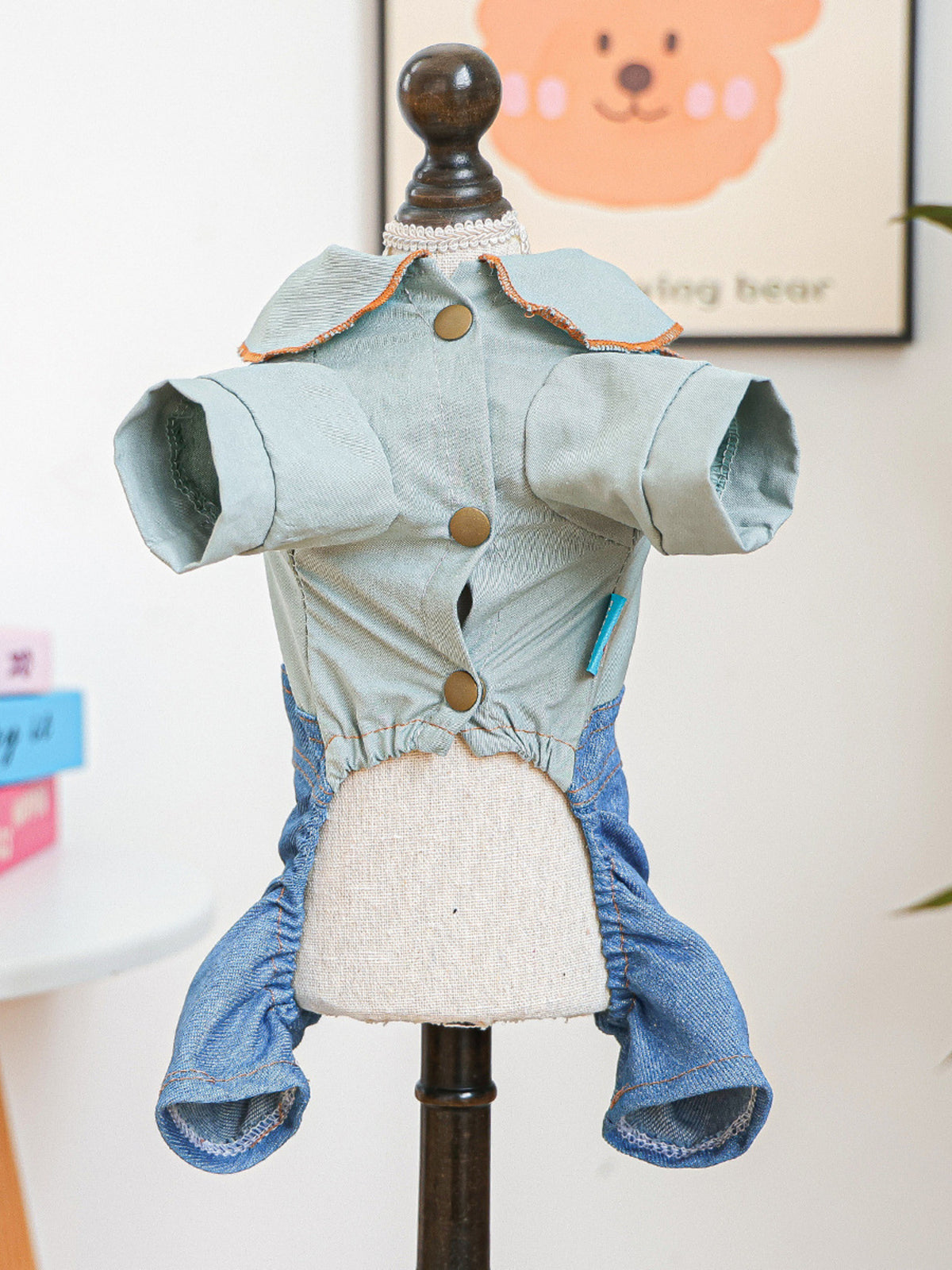 Denim pet jumpsuit with bowknot detail, stylish pet clothing from Trendsi, featuring adjustable straps and cute design.
