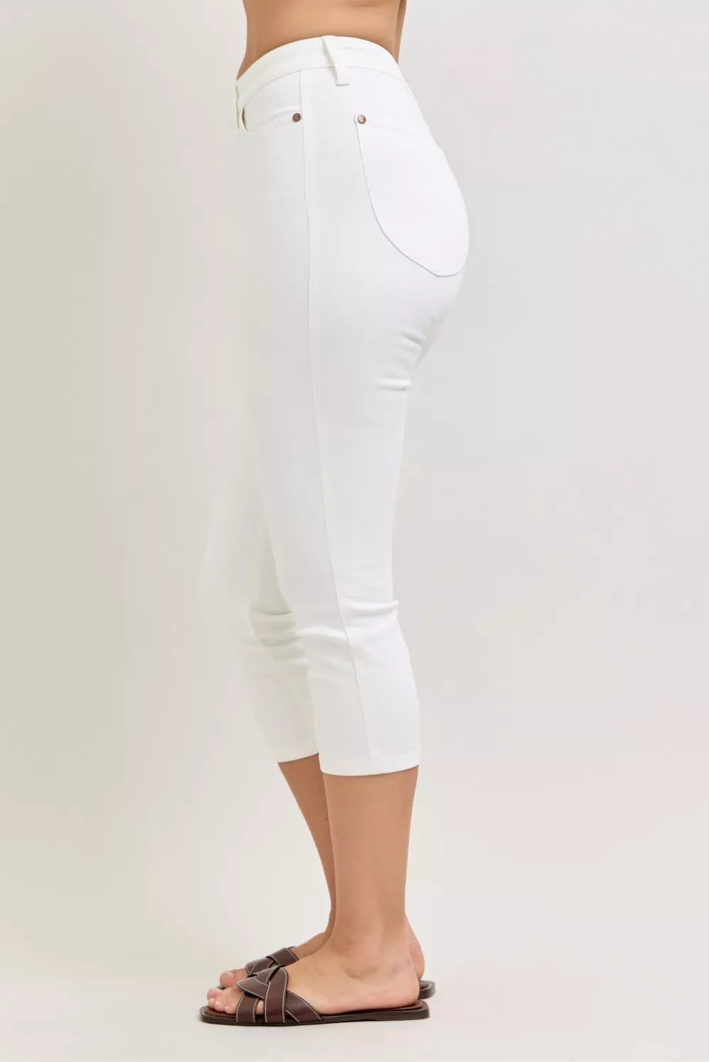 Trendsi Judy Blue high waist extended waistband capri pants with spade pockets, denim style and fitted design.