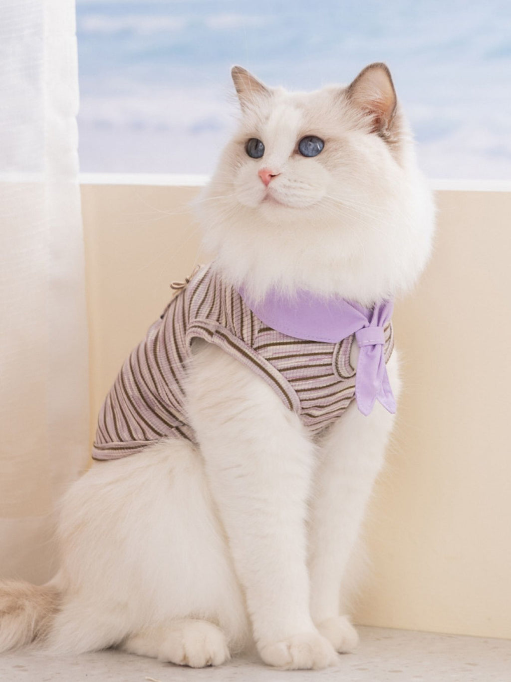 Striped tied pet top from Trendsi featuring a stylish design and adjustable tie detail, ideal for fashionable pets.