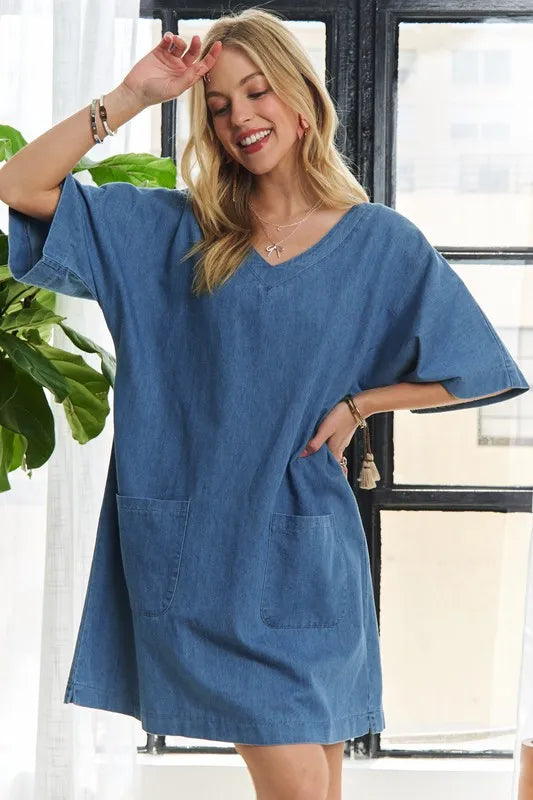 Trendsi ADORA V-Neck Half Sleeve Mini Denim Dress displayed on a hanger with a casual style and light blue wash.