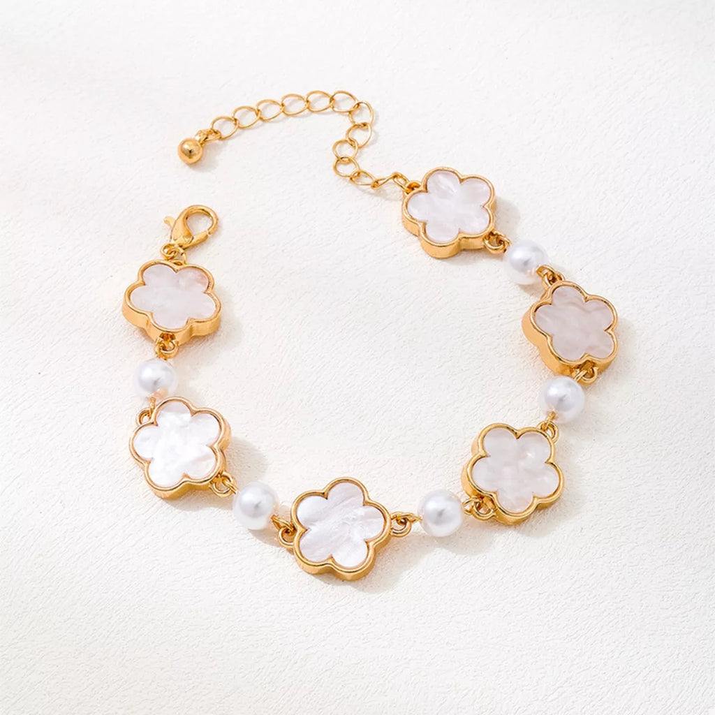 Gold-plated alloy flower bracelet with delicate floral design, perfect for elegant jewelry styling