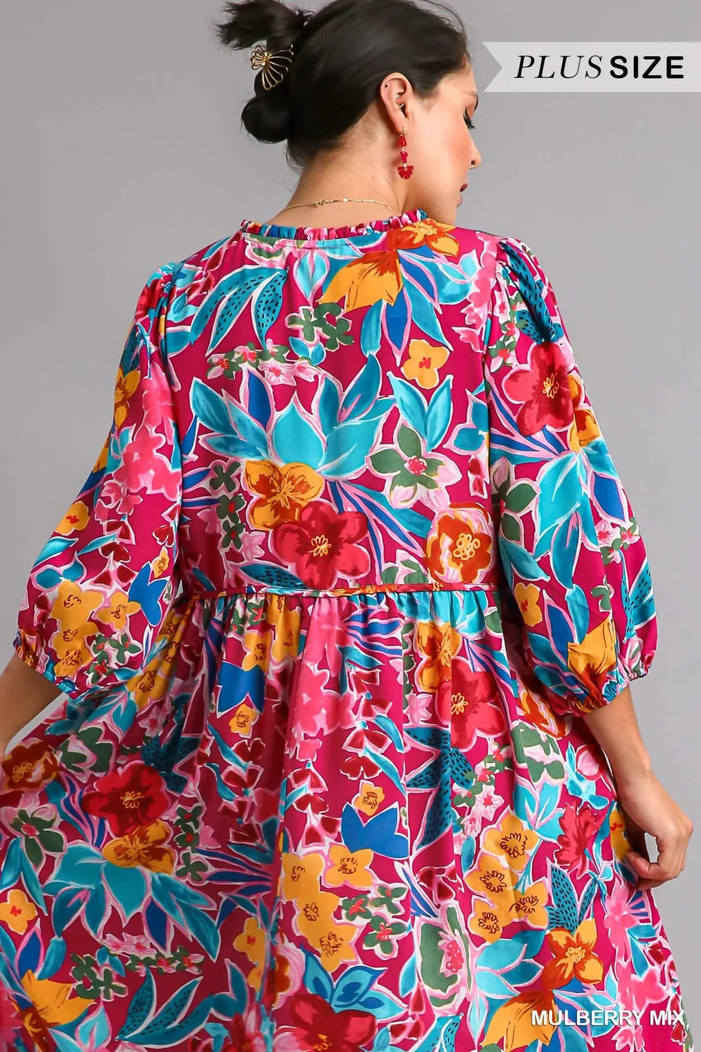 Plus size Umgee floral print midi dress with tie neck and pockets, featuring a full-length design and vibrant floral pattern.