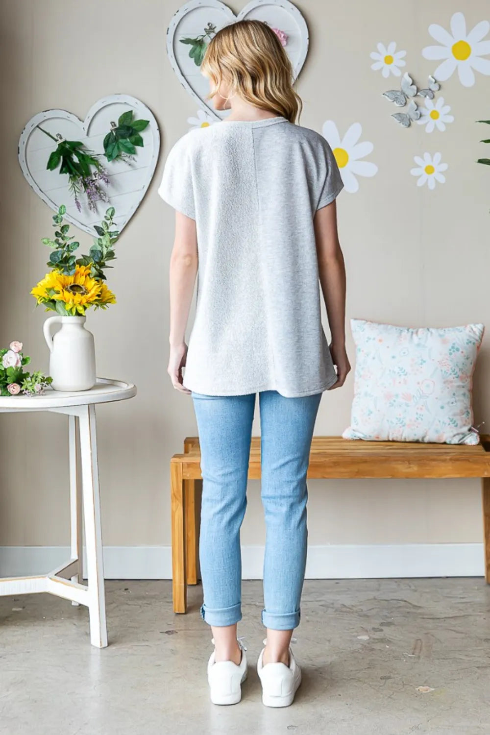 Heimish full size pocketed round neck short sleeve T-shirt in black, featuring a pocket on the front and a classic fit.