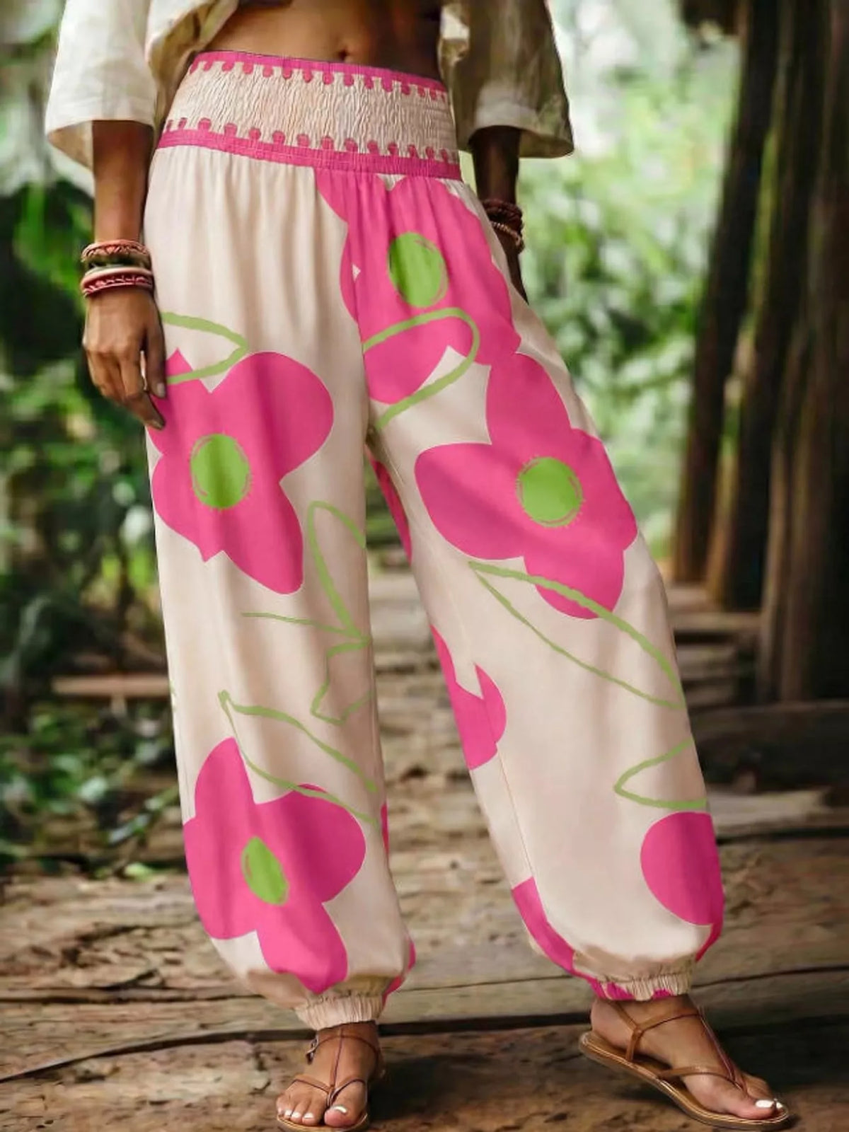 Floral print wide-leg pants from Trendsi featuring a flowy design and vibrant flower patterns on lightweight fabric.