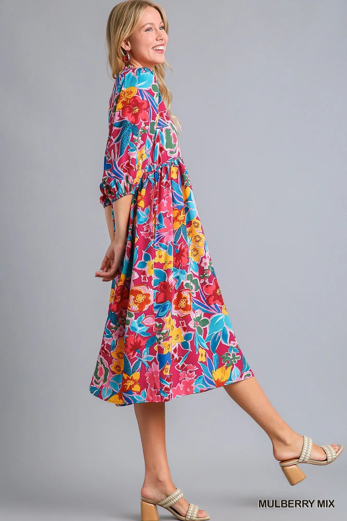 Plus size Umgee floral print tie neck midi dress with pockets, featuring a full-length design and vibrant pattern.