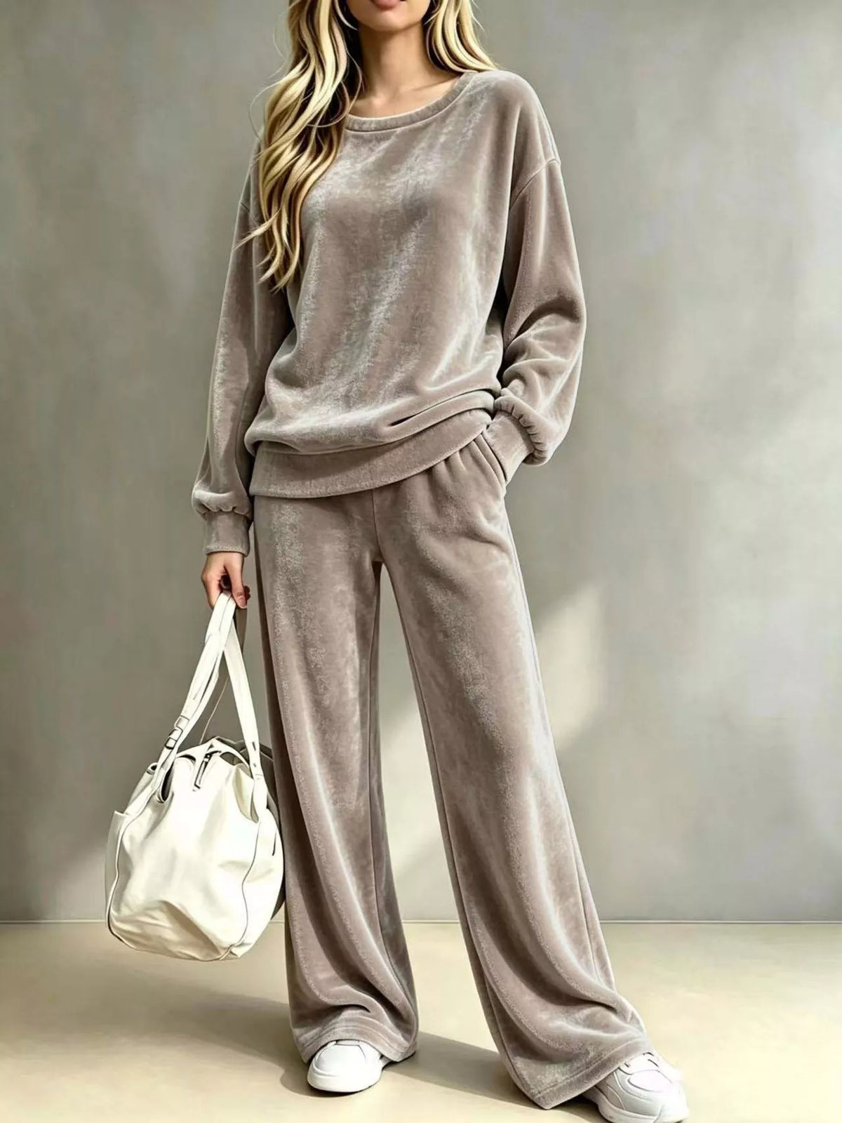 Plus size velvet dropped shoulder top and wide-leg pants set by Trendsi, featuring a luxurious fabric and relaxed fit.
