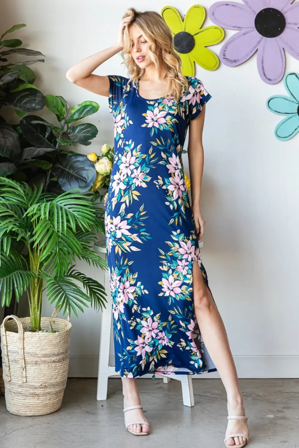 Heimish floral short sleeve slit dress with a full size fit, featuring a vibrant floral pattern and a stylish slit design.