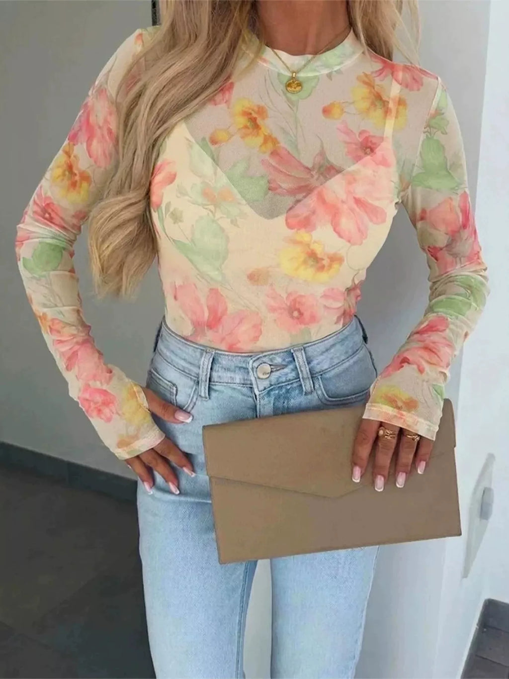 Plus size floral print sheer mesh long sleeve T-shirt from Trendsi, featuring a full-size floral pattern and lightweight, breathable fabric.