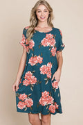 Trendsi BOMBOM floral round neck short tee dress with pockets, lightweight fabric, and colorful floral pattern.