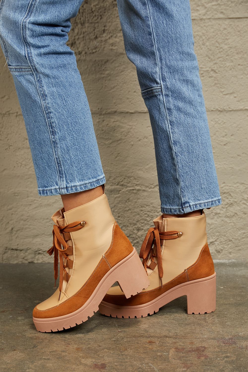 East Lion Corp lace-up lug booties with chunky soles and leather upper, stylish and rugged footwear for casual wear.