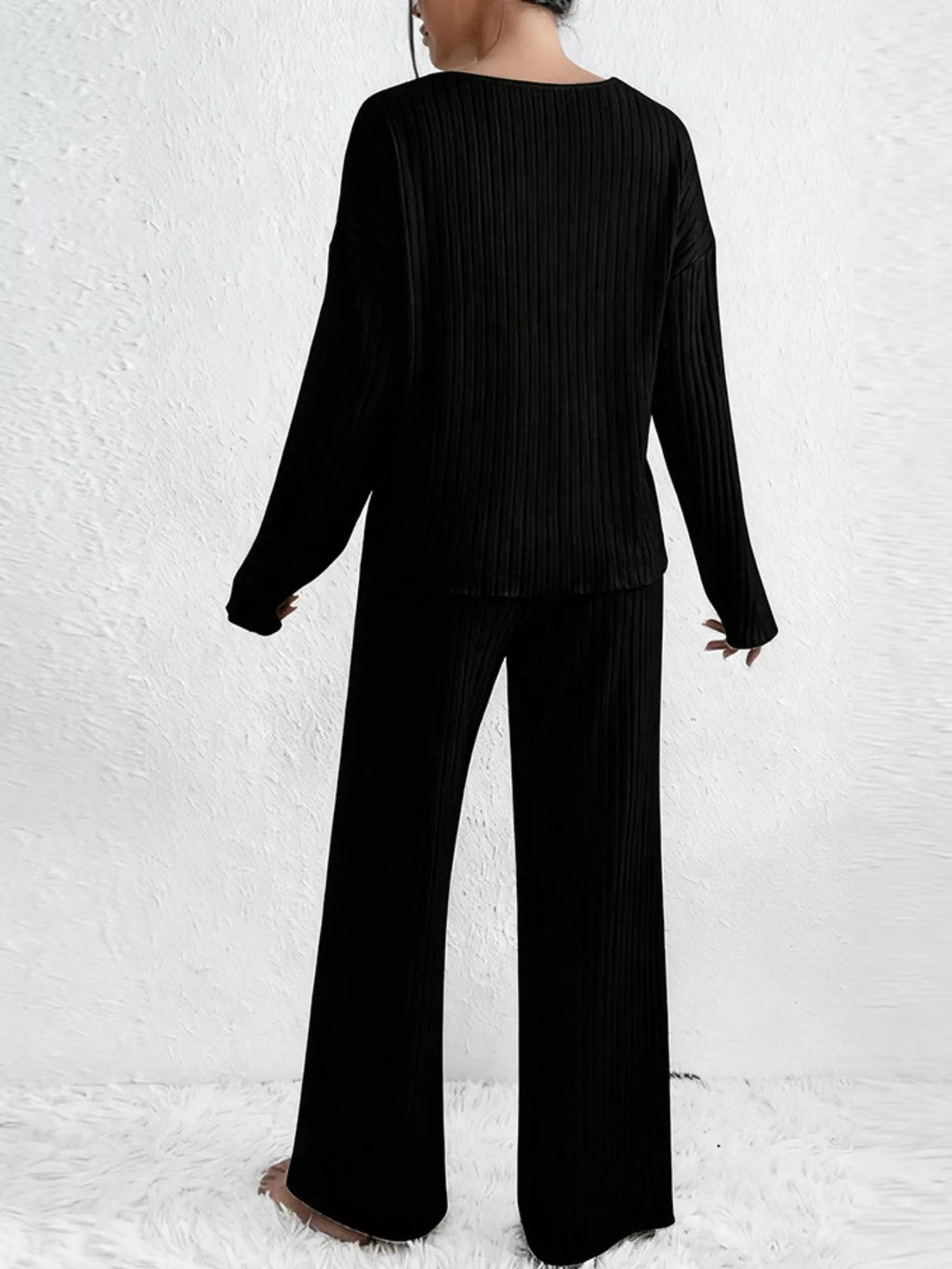 Ribbed knit V-neck top and matching pants set by Trendsi, in a cozy, textured fabric, shown in a neutral color on a model.