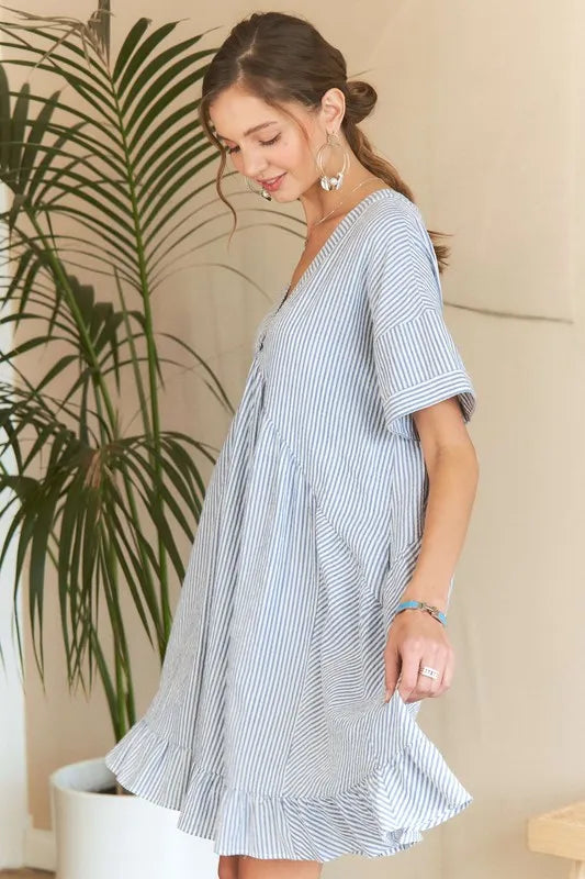 Striped ADORA Ruffled Hem V-Neck Babydoll Dress by Trendsi featuring a ruffled hem and a stylish V-neck design.