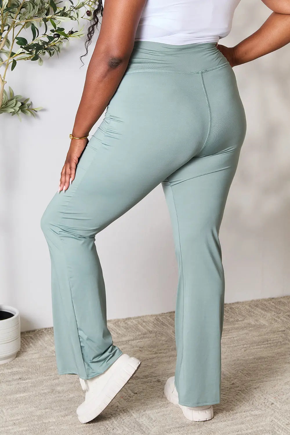 Heimish full-size wide waistband sports pants in plus size, featuring a comfortable fit and stylish design, shown in black.