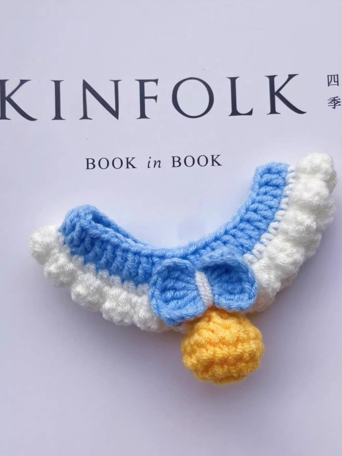Crochet pet collar with bell from Trendsi featuring a colorful, handwoven design and a small metallic bell for pets.