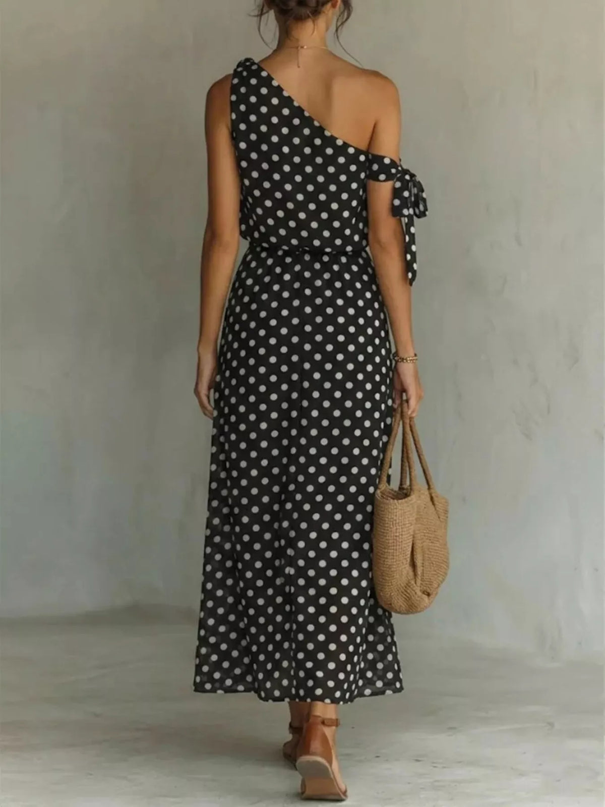 Full size polka dot one-shoulder maxi dress by Trendsi, featuring a flowing silhouette and stylish design for plus size women.