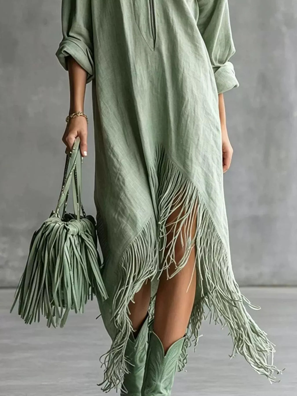 Trendsi fringe hem zip-up shirt dress featuring a stylish front zipper, long sleeves, and a flowing hem with fringe details.