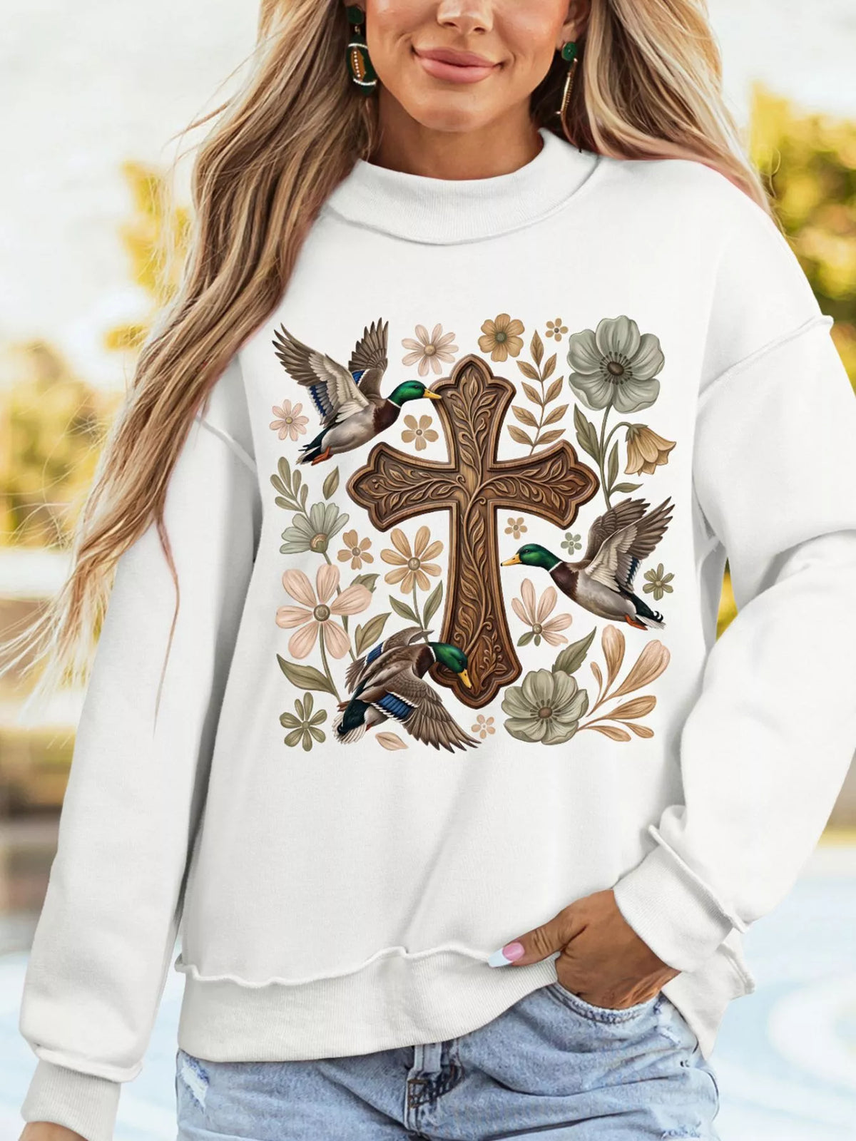 White mock neck sweatshirt with floral cross print