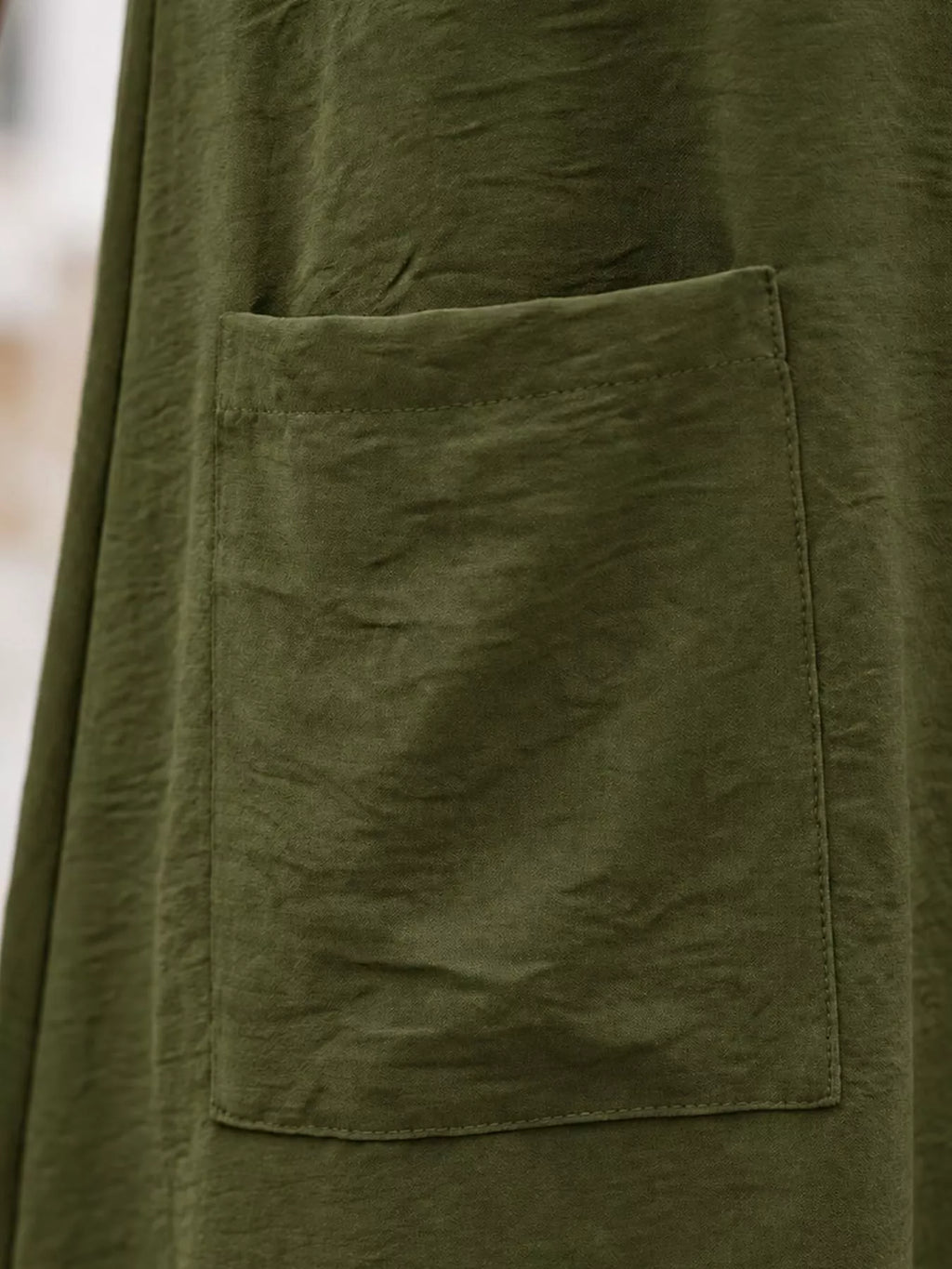 Loose fit T-shirt dress with pockets from Trendsi, shown in a casual, comfortable style in soft fabric.
