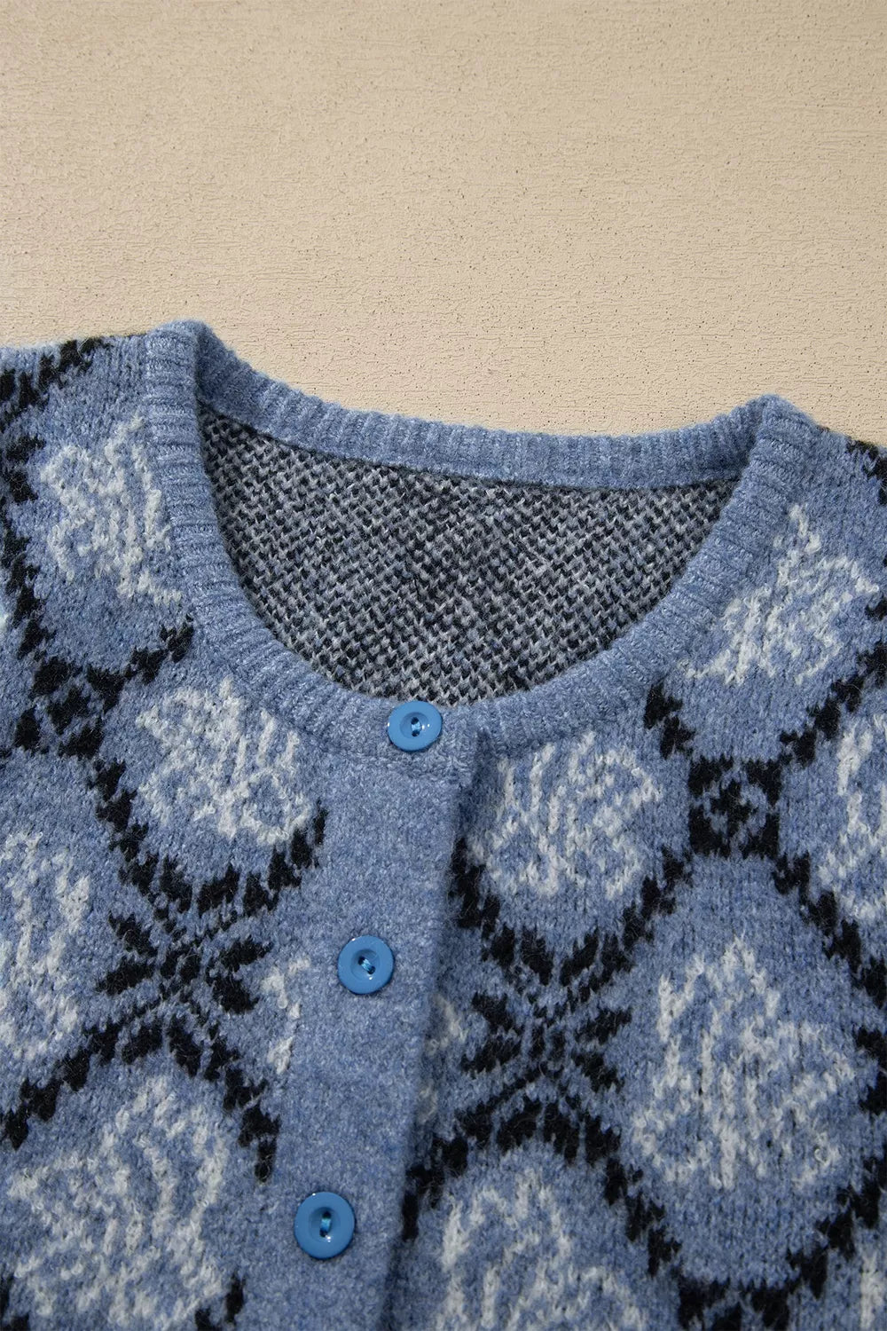 Short sleeve boho knit top with button front cardigan by Trendsi, featuring a relaxed fit and stylish design.