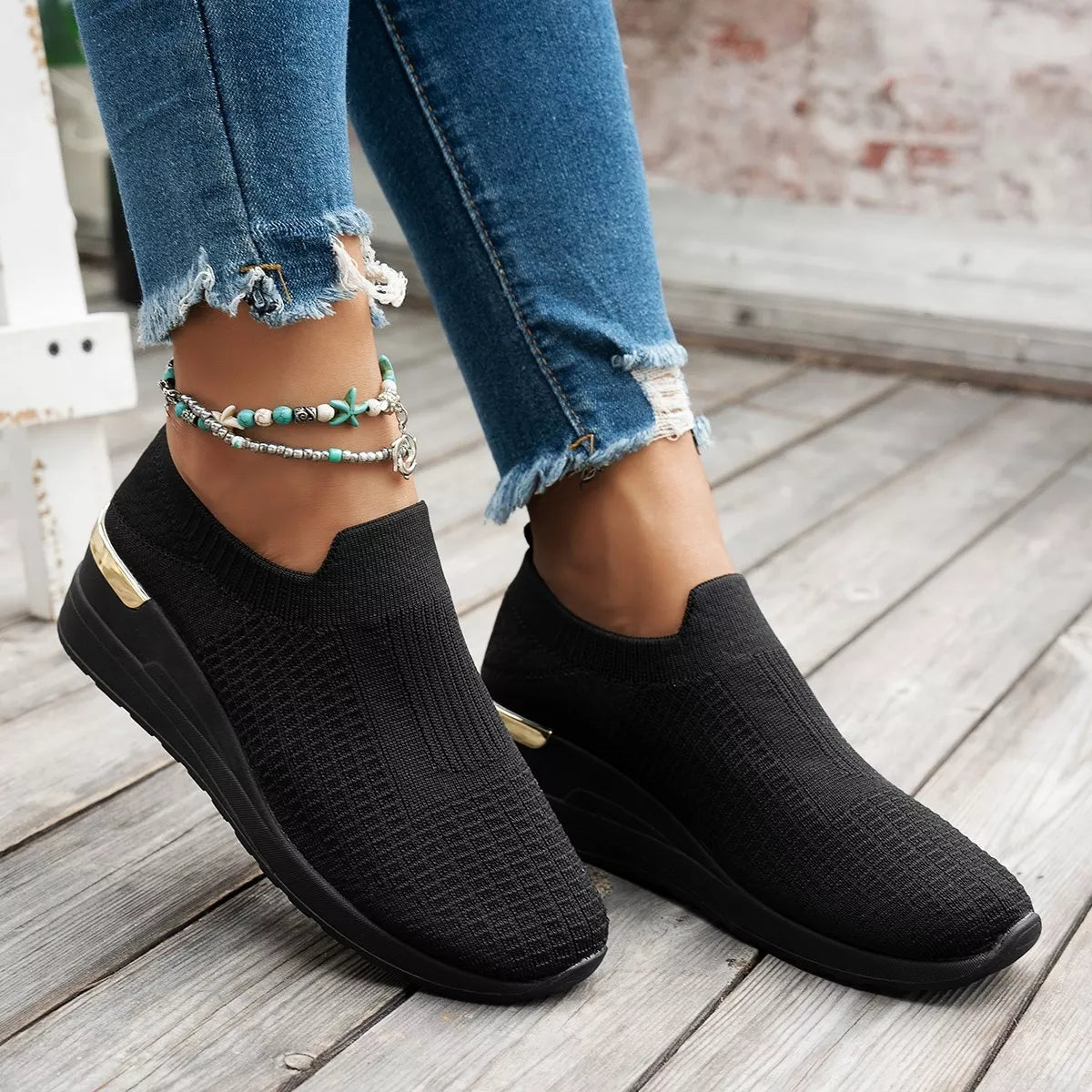 Mesh round toe wedge athletic shoes by Trendsi featuring breathable mesh material and sporty design.