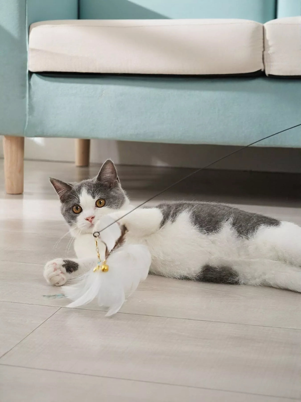 Interactive feather teaser cat wand toy by Trendsi with colorful feathers and a flexible wand for playful feline fun.