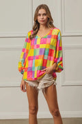 Colorful BiBi Multi Block Bubble Pop Balloon top by Trendsi, featuring vibrant bubbles and playful design.