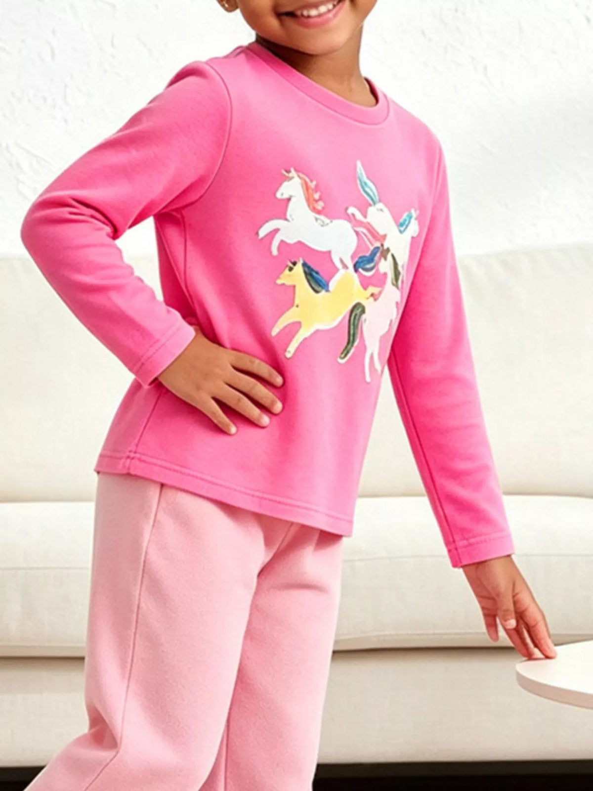 Children's unicorn graphic long-sleeve T-shirt by Trendsi featuring a colorful unicorn design on soft fabric.