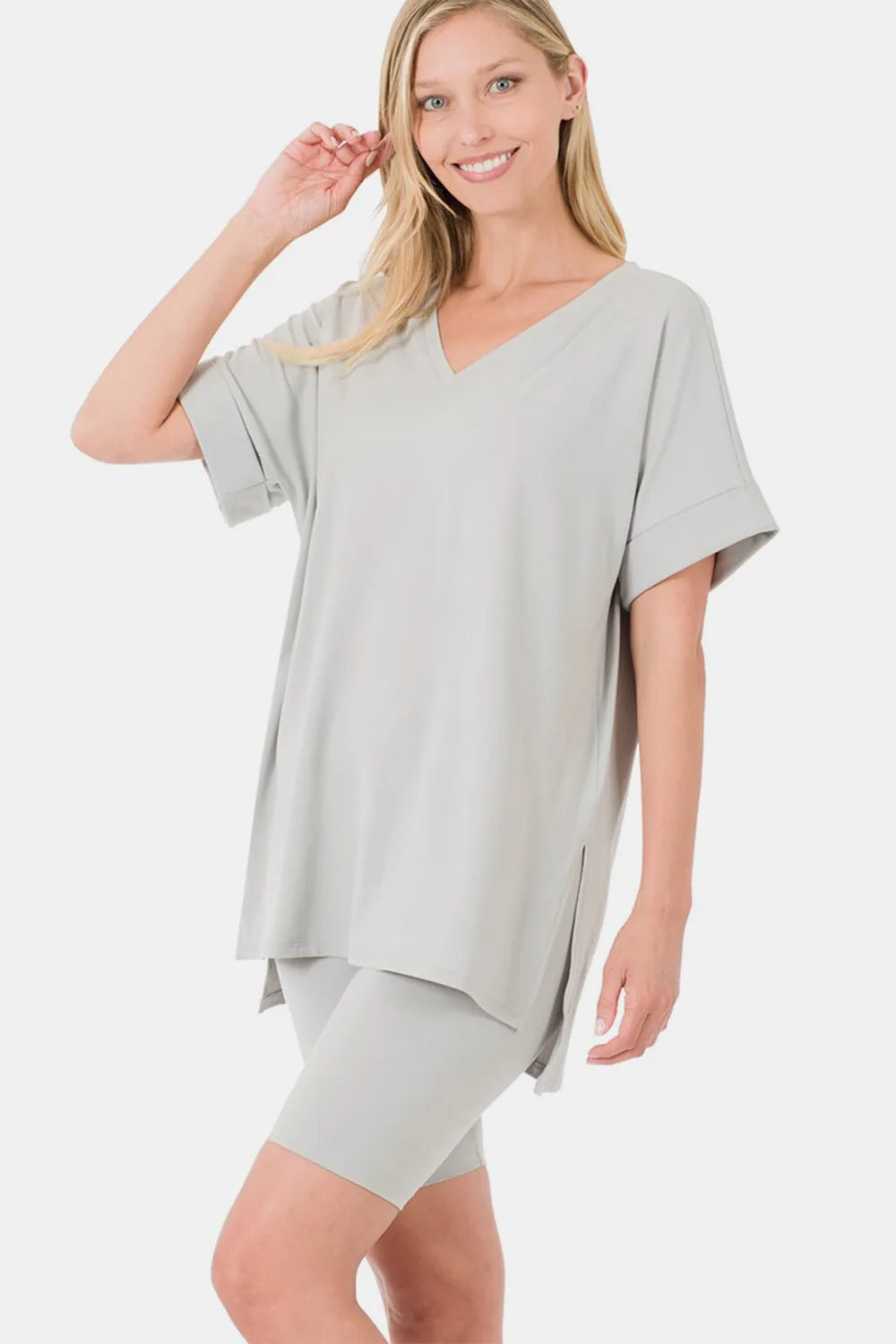 Zenana full-size V-neck short sleeve T-shirt and shorts set by Trendsi, featuring a comfortable, casual design and slit details.