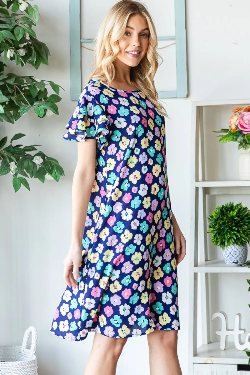 Heimish floral ruffled short sleeve dress with pockets, full size, trendy design, lightweight fabric, and feminine floral pattern.