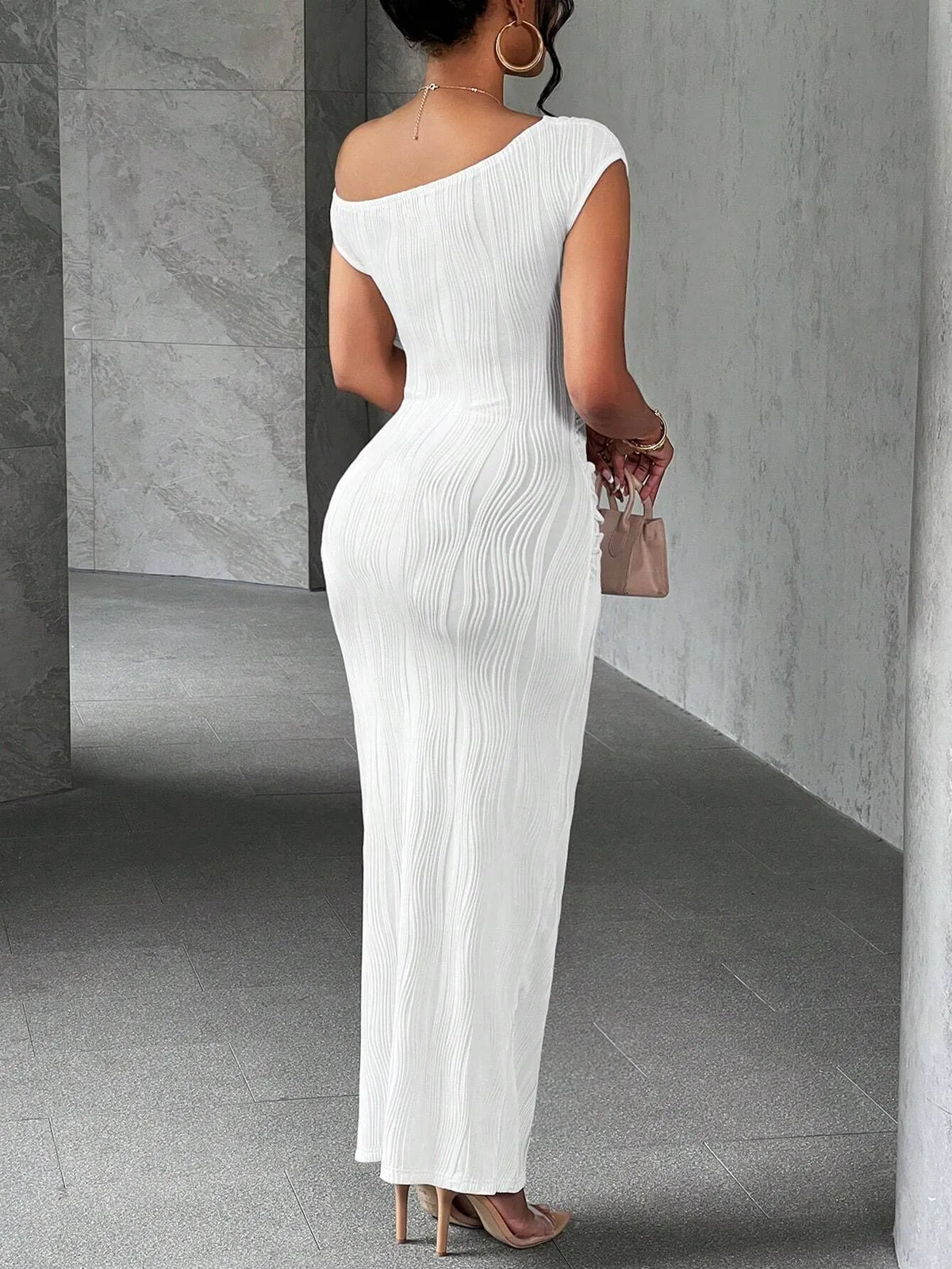 Asymmetrical one-shoulder black bodycon maxi dress by Trendsi, featuring a fitted silhouette and stylish design.
