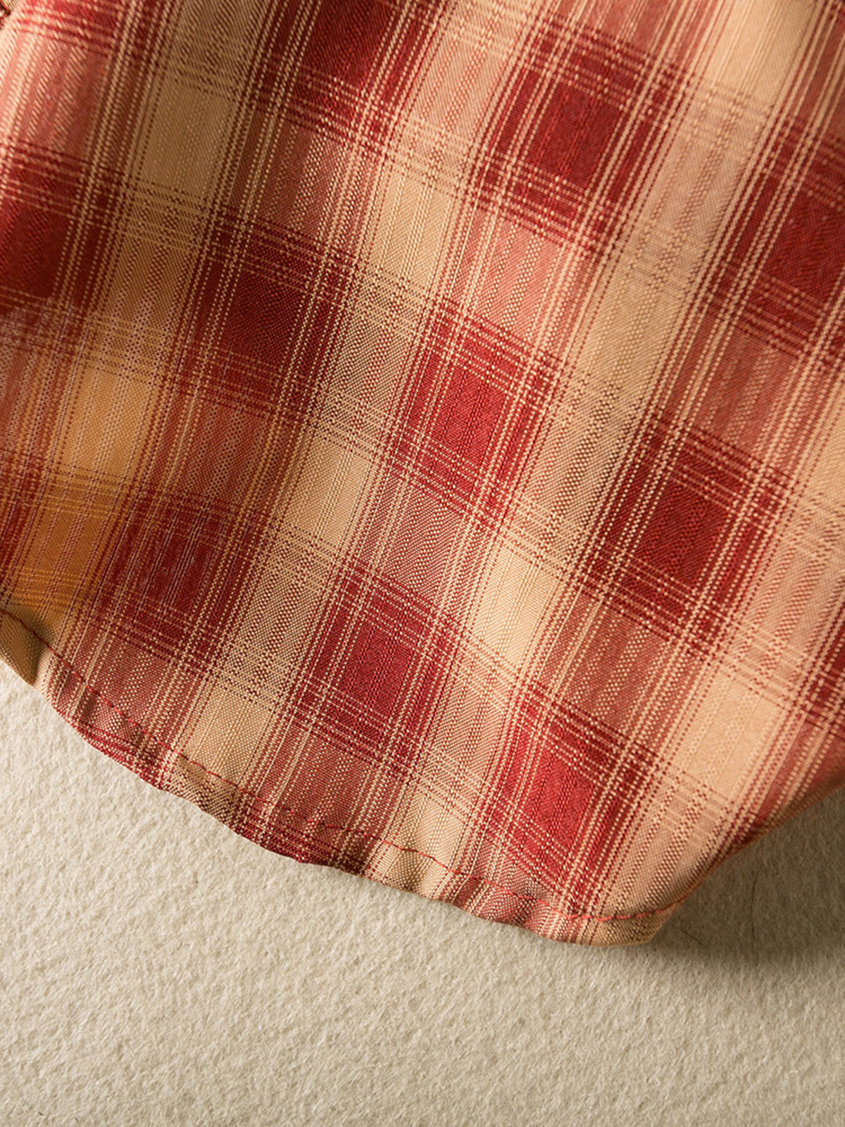 Plaid button-down pet shirt by Trendsi featuring a stylish red and black checked design for dogs or cats.