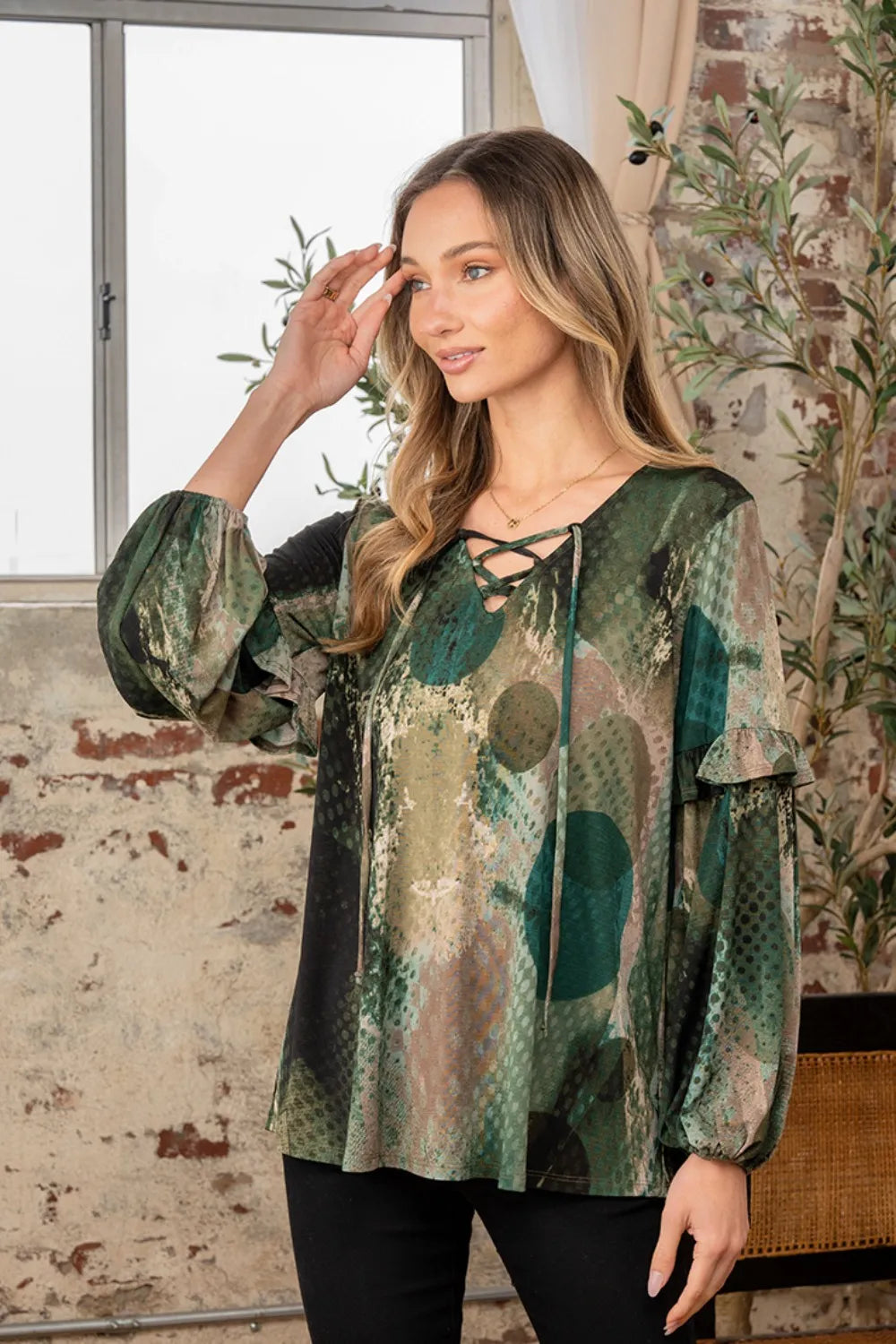 Trendsi Sew In Love snakeskin print long sleeve top with ruffle detail, showcasing the full size, fitted design and vibrant pattern.