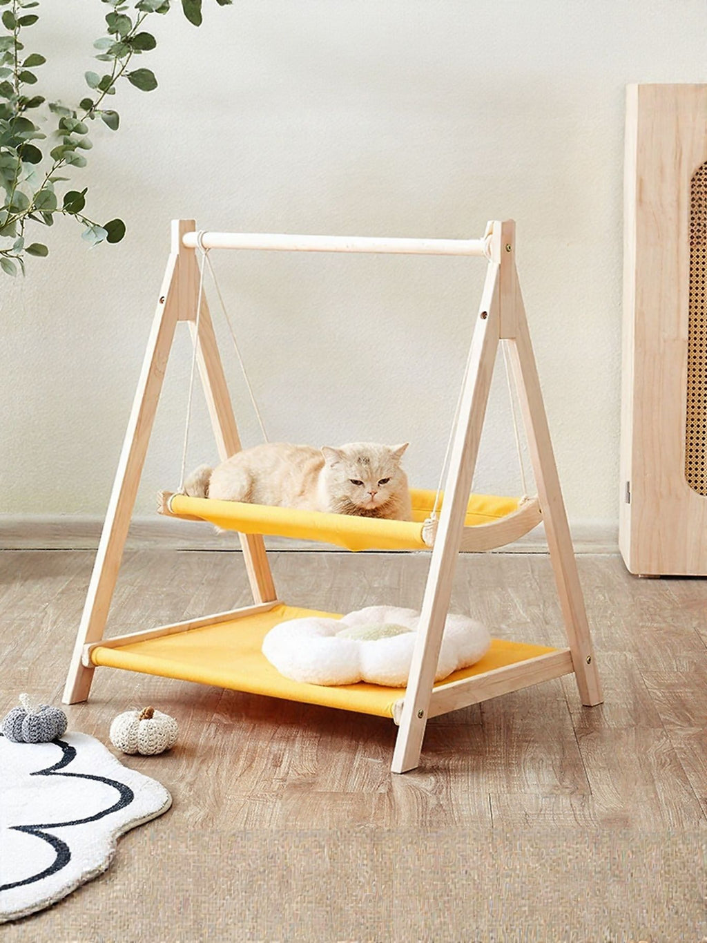 Wooden triangle cat hammock by Trendsi, showing a cozy hanging bed with wooden frame and soft fabric for feline relaxation.