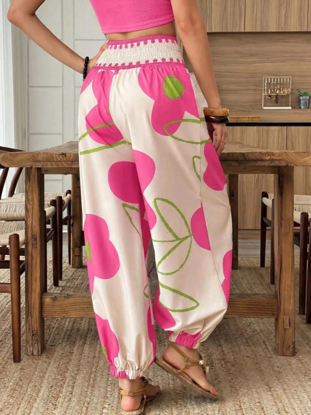 Floral print wide-leg pants from Trendsi featuring a flowy design and vibrant flower pattern, styled on a model.
