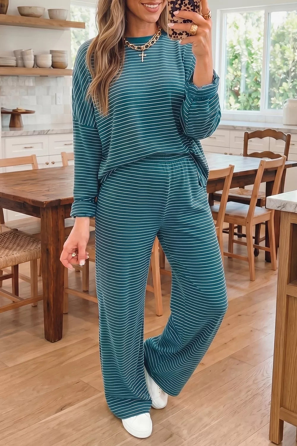 Stripe dropped shoulder long sleeve top with elastic waist casual pants 2-piece set by Trendsi, shown in a comfortable, relaxed fit.