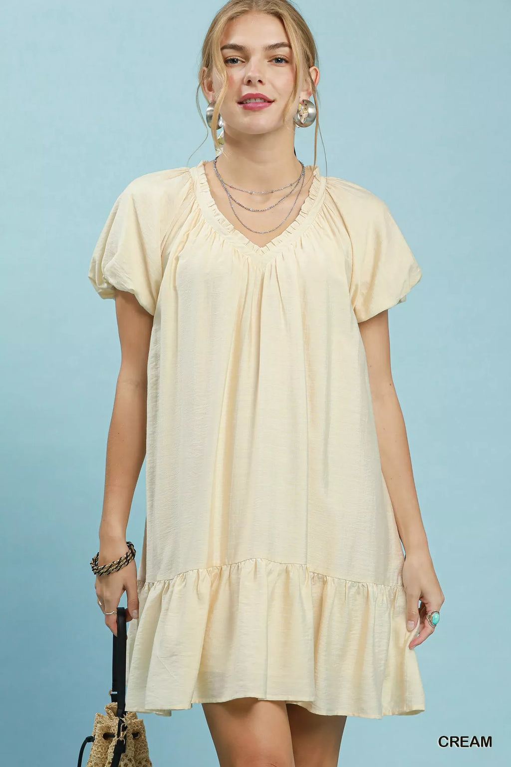 Umgee ruffle hem shift mini dress with floral print, sleeveless design, and relaxed fit, ideal for casual summer wear.