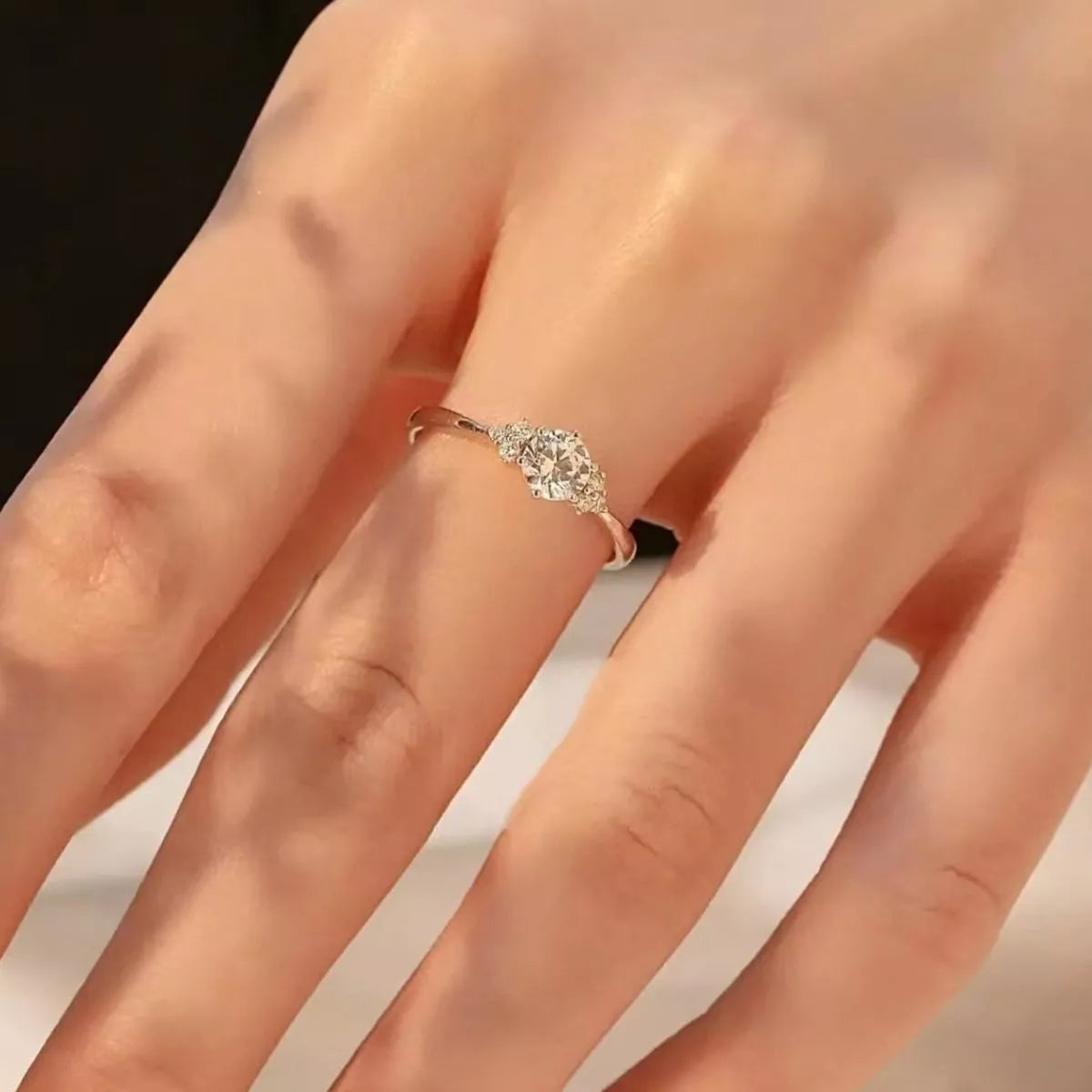 Sterling silver ring with 1 carat moissanite gemstone, featuring a sleek and elegant design.