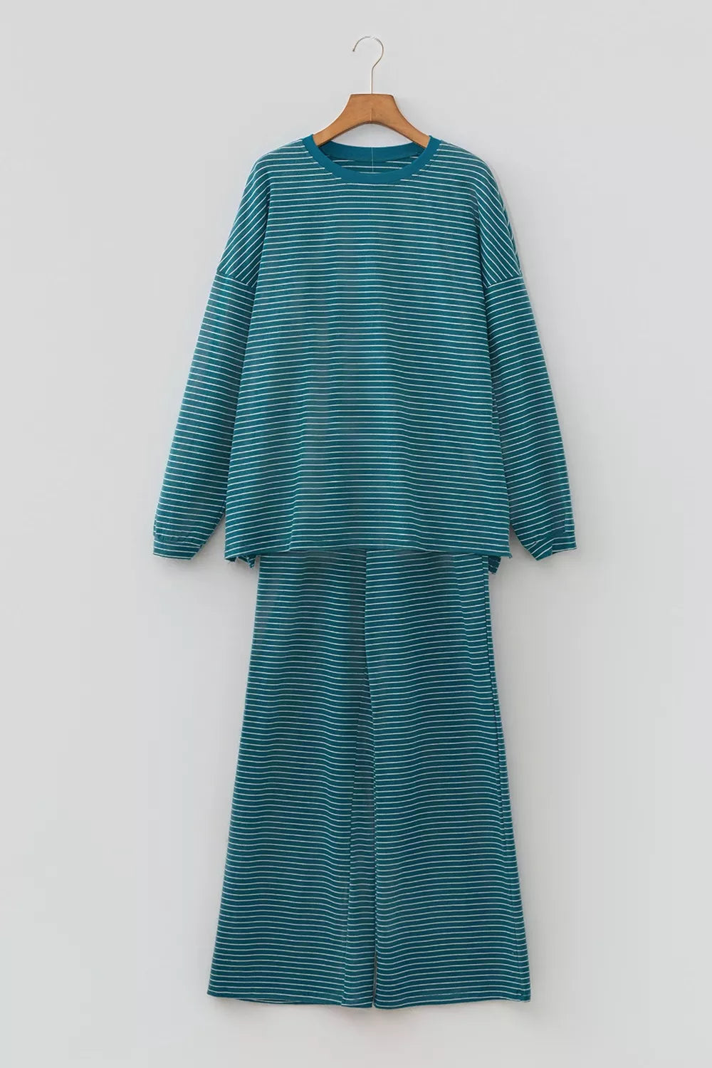 Stripe dropped shoulder long sleeve top and elastic waist casual pants set by Trendsi, featuring comfortable, stylish loungewear.
