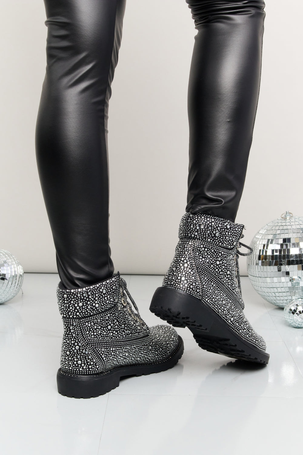 Forever Link rhinestone lace-up combat boots with studded details and chunky soles, stylish footwear by Trendsi.
