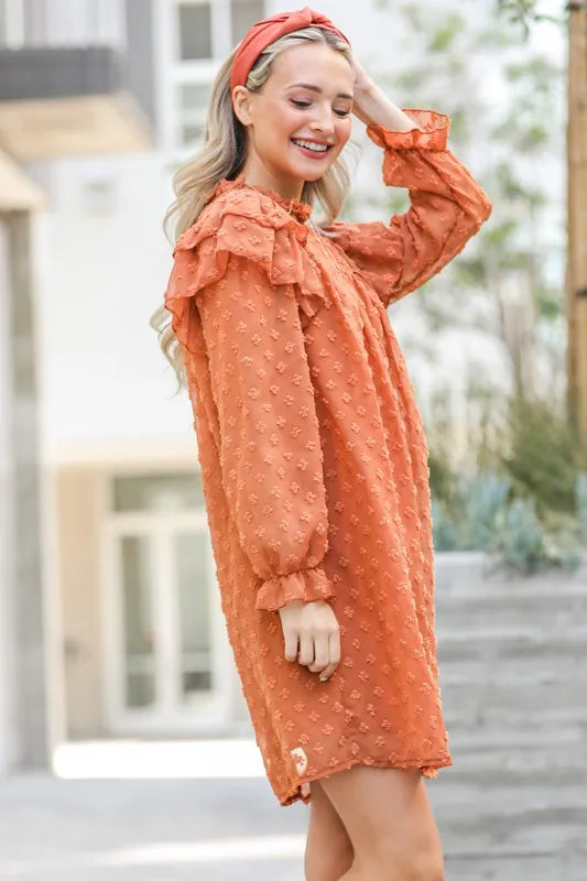 Textured woven dress with ruffle shoulder design from Trendsi, showcasing a stylish, flowy silhouette in a vibrant, patterned fabric.