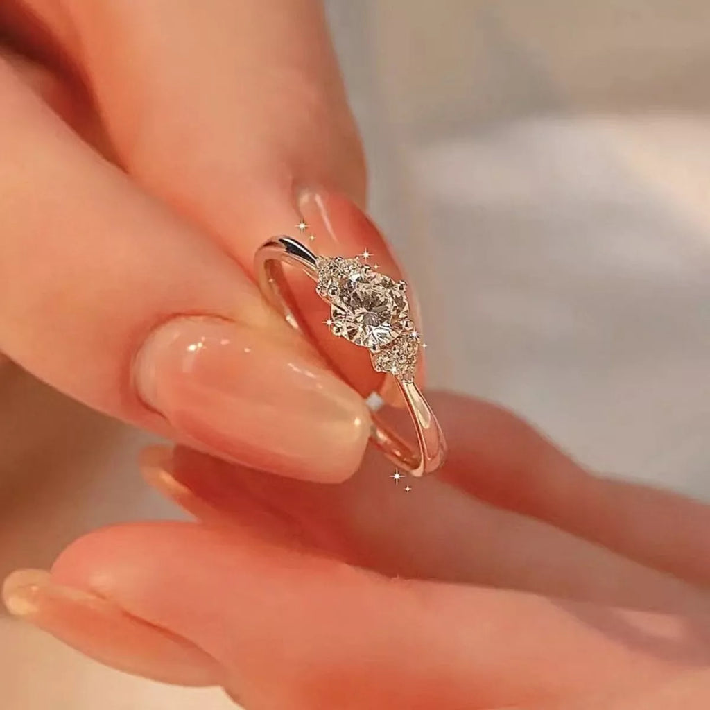 Sterling silver ring with 1-carat moissanite gemstone, featuring a sleek design and shiny finish.