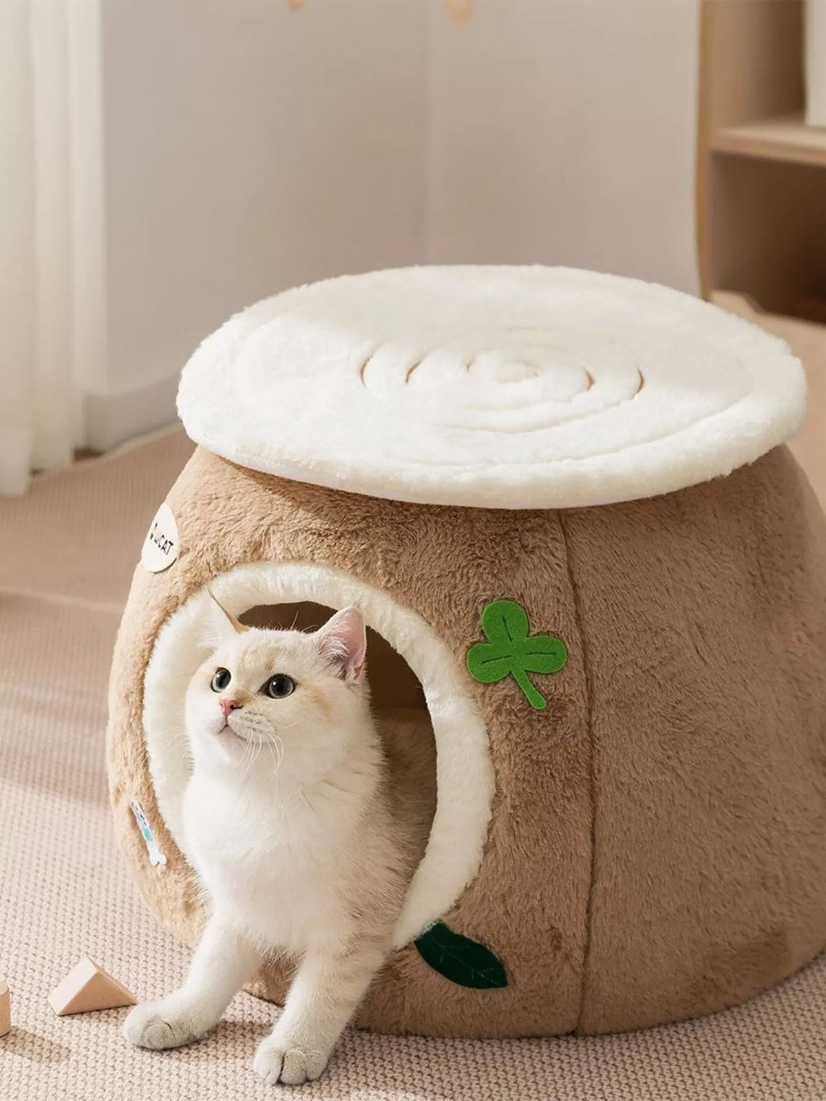 Cozy Tree Stump Pet Nest from Trendsi, showcasing a plush, natural-looking pet bed with a tree stump design for small pets.