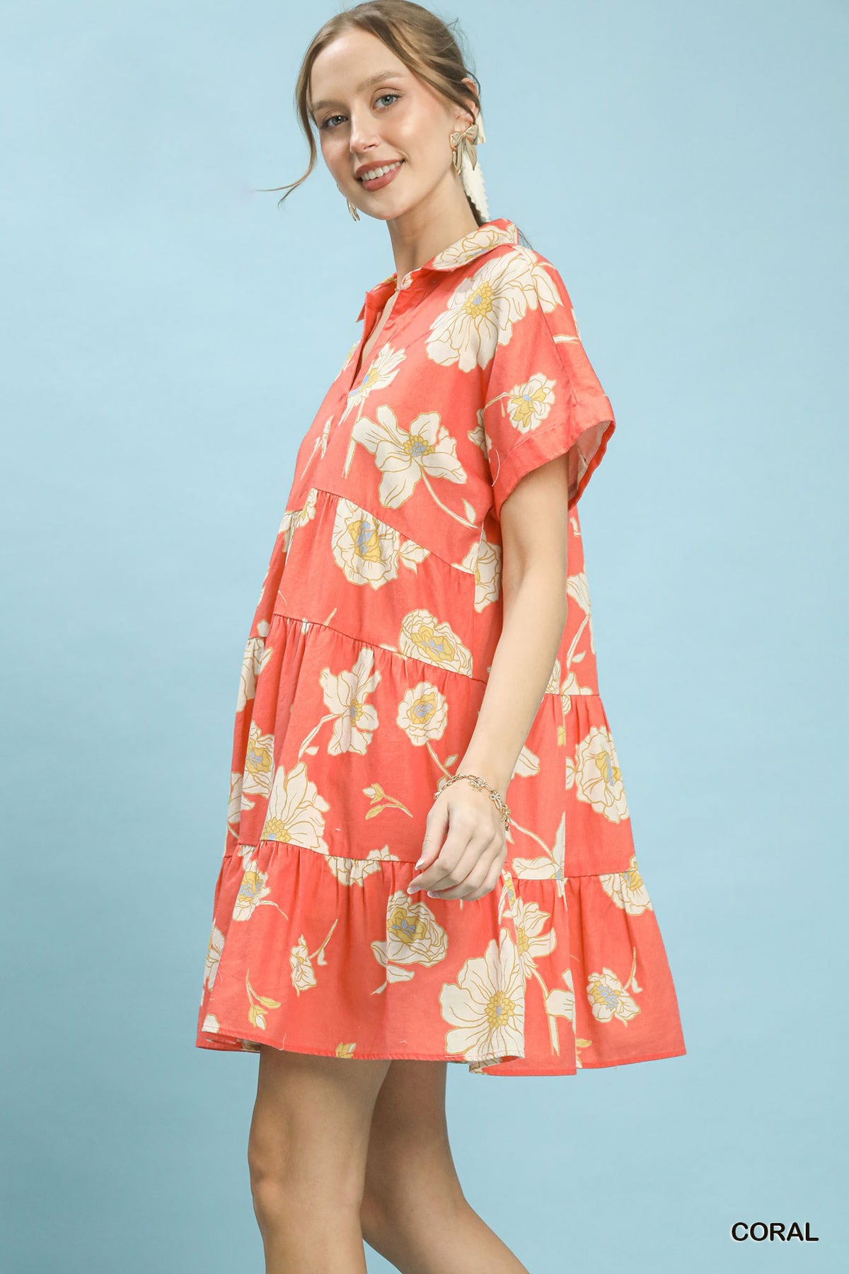 Umgee floral tiered babydoll dress with a collared neckline, featuring a feminine and flowy design for casual or dressy occasions.